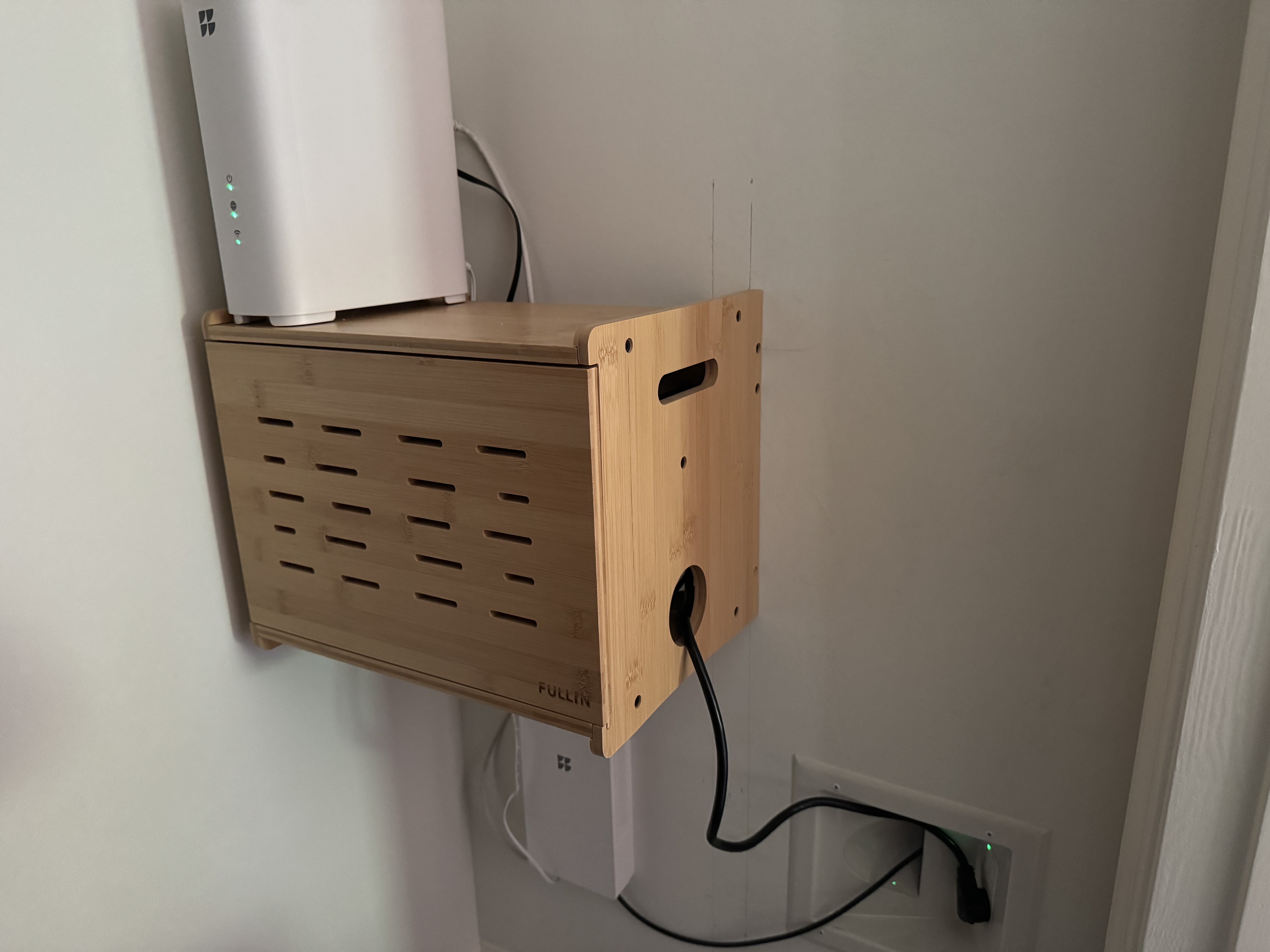 Closet setup with wooden enclosure holding the home server stack